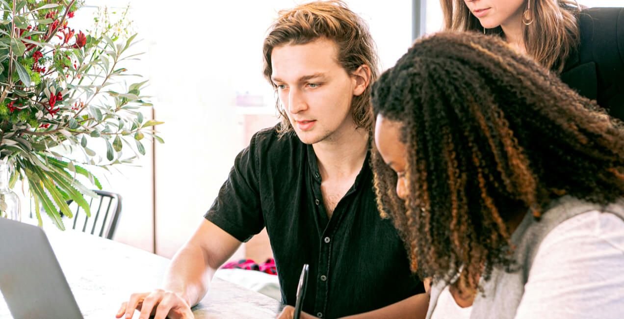 Recruiter and hiring manager discussing job requirements in a meeting