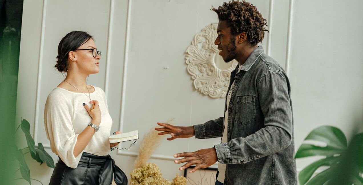 Recruiter and hiring manager reviewing hiring process post-hire